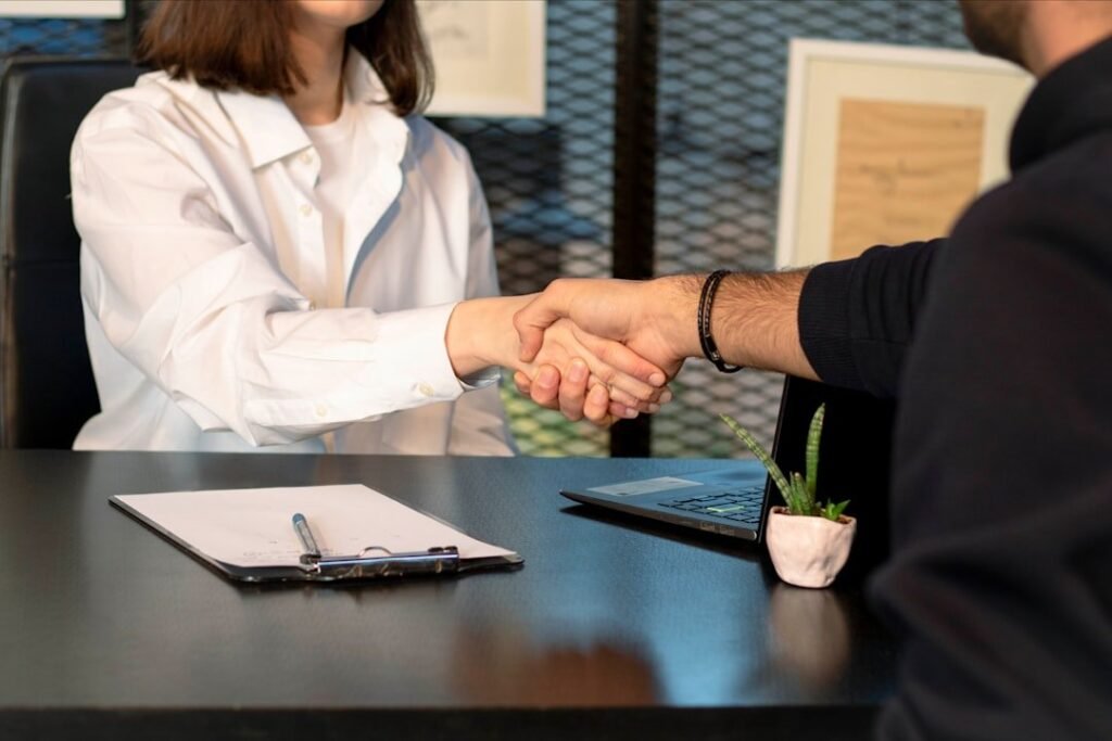 Singapore job seekers in a professional office setting — retrenchments and hiring in Q2 2026