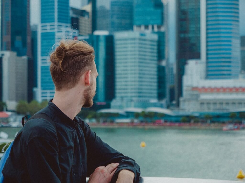 Professional worker overlooking Singapore city skyline representing career decisions in 2026 labour market